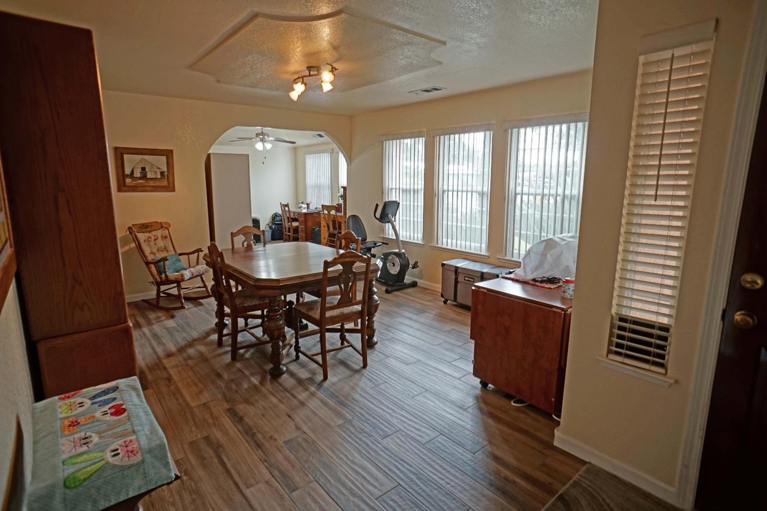 2197 Polson Avenue Clovis, CA 93611 - Photo 16 of 42 a view of a dining room with furniture window and wooden floor