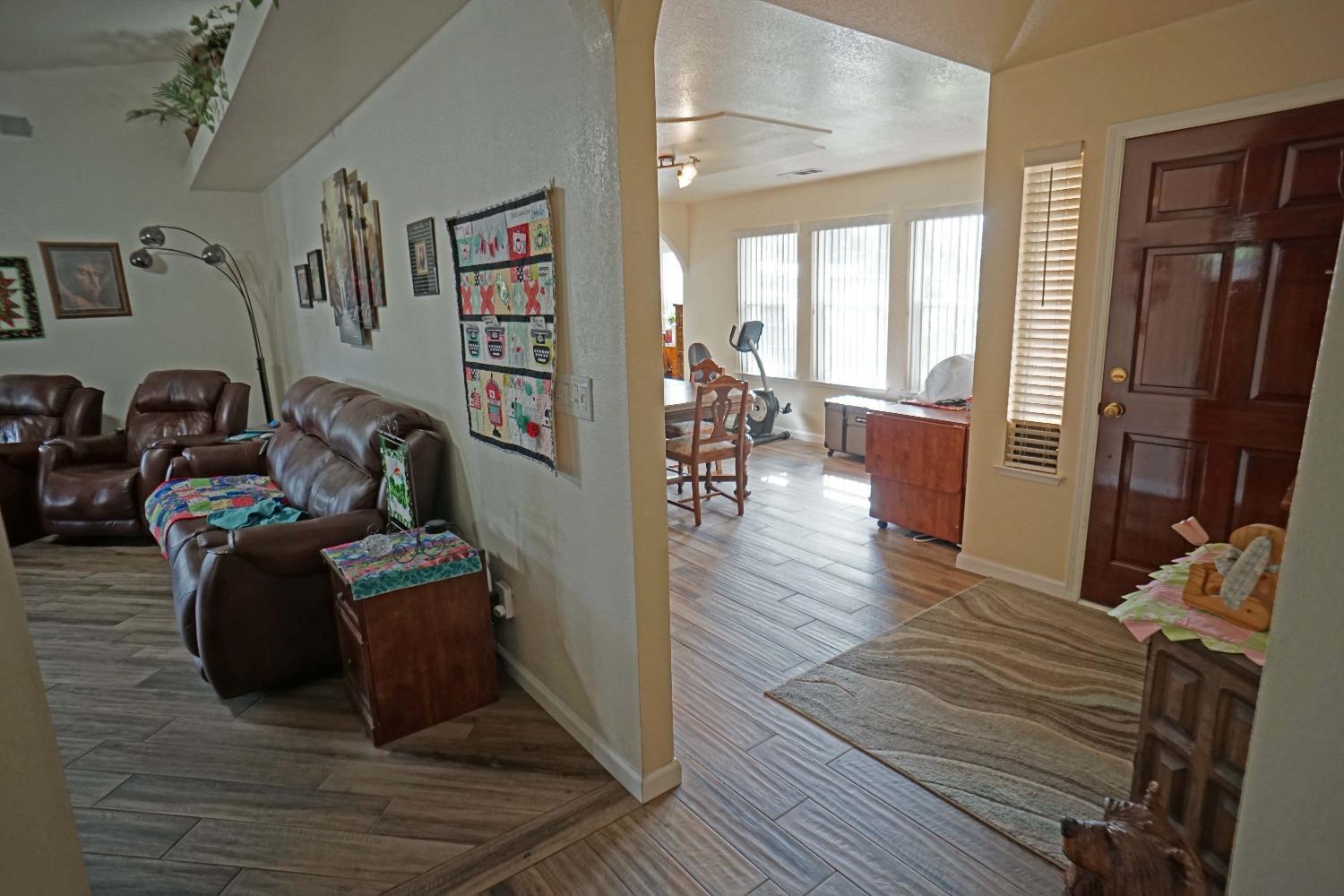 2197 Polson Avenue Clovis, CA 93611 - Photo 17 of 42 a living room with furniture and wooden floor