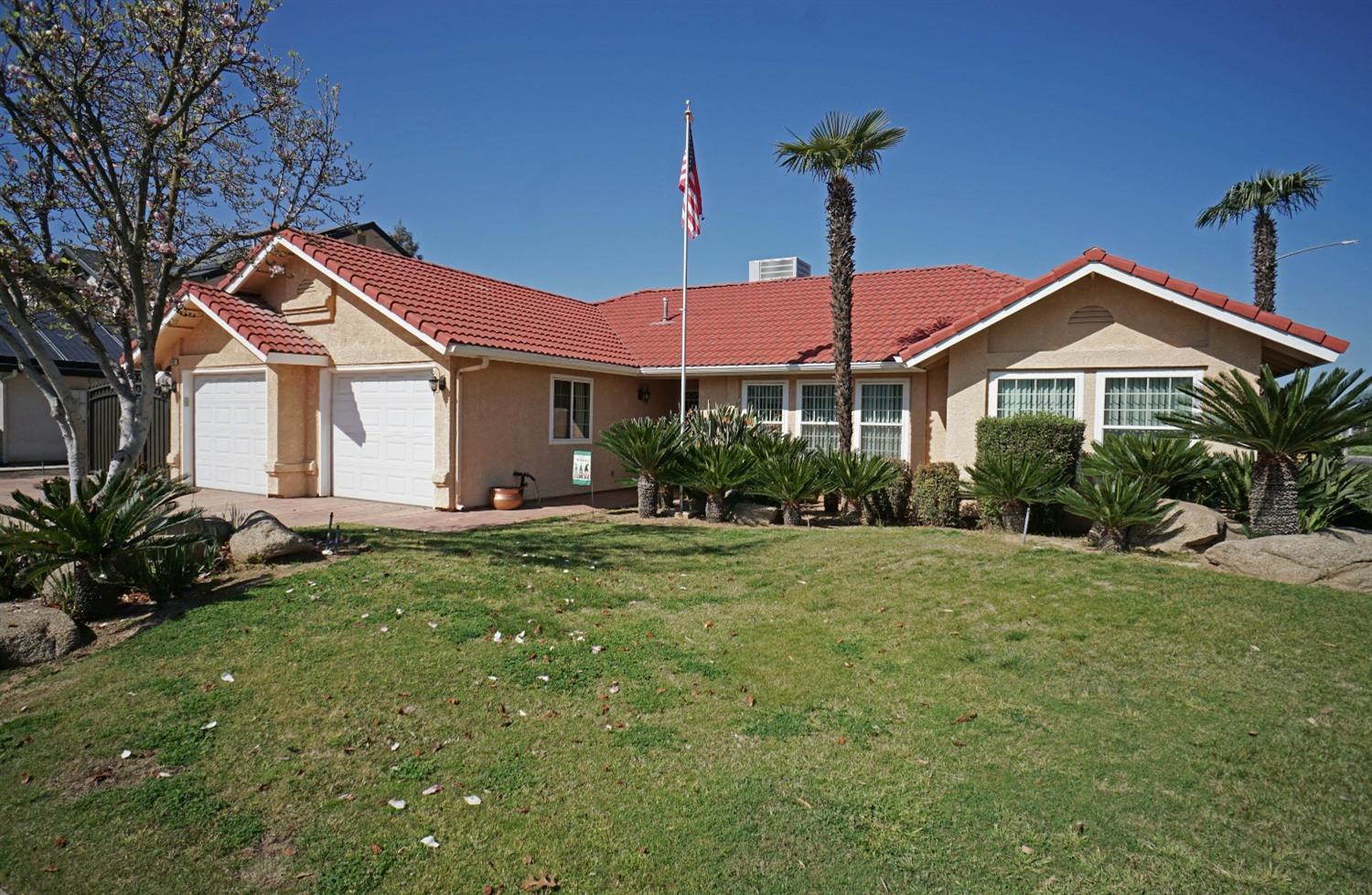 2197 Polson Avenue Clovis, CA 93611 - Photo 2 of 42 a front view of a house with garden
