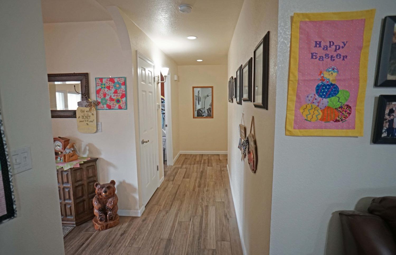 2197 Polson Avenue Clovis, CA 93611 - Photo 31 of 42 a view of a hallway with wooden floor and closet