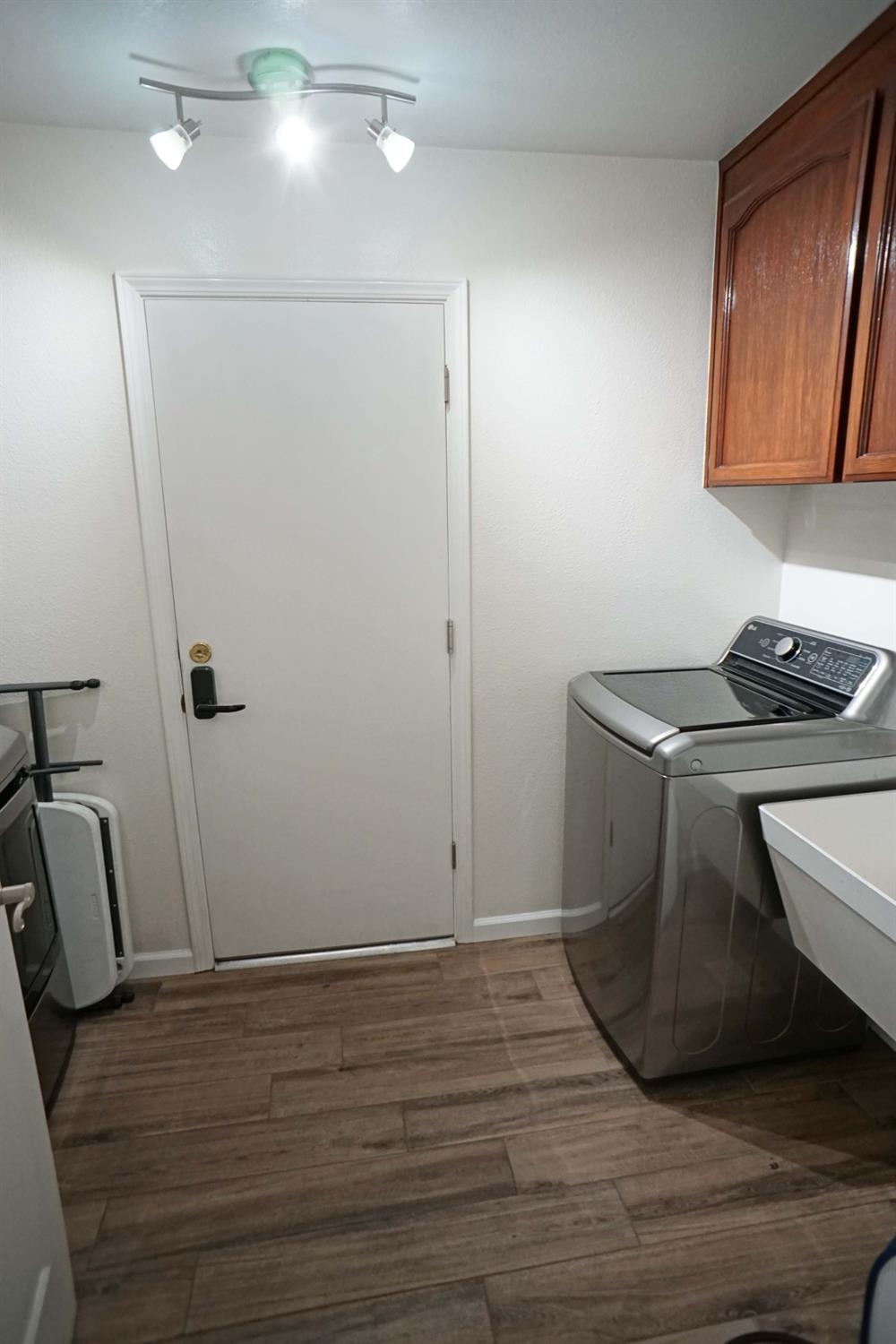 2197 Polson Avenue Clovis, CA 93611 - Photo 32 of 42 a room with wooden floor and utility