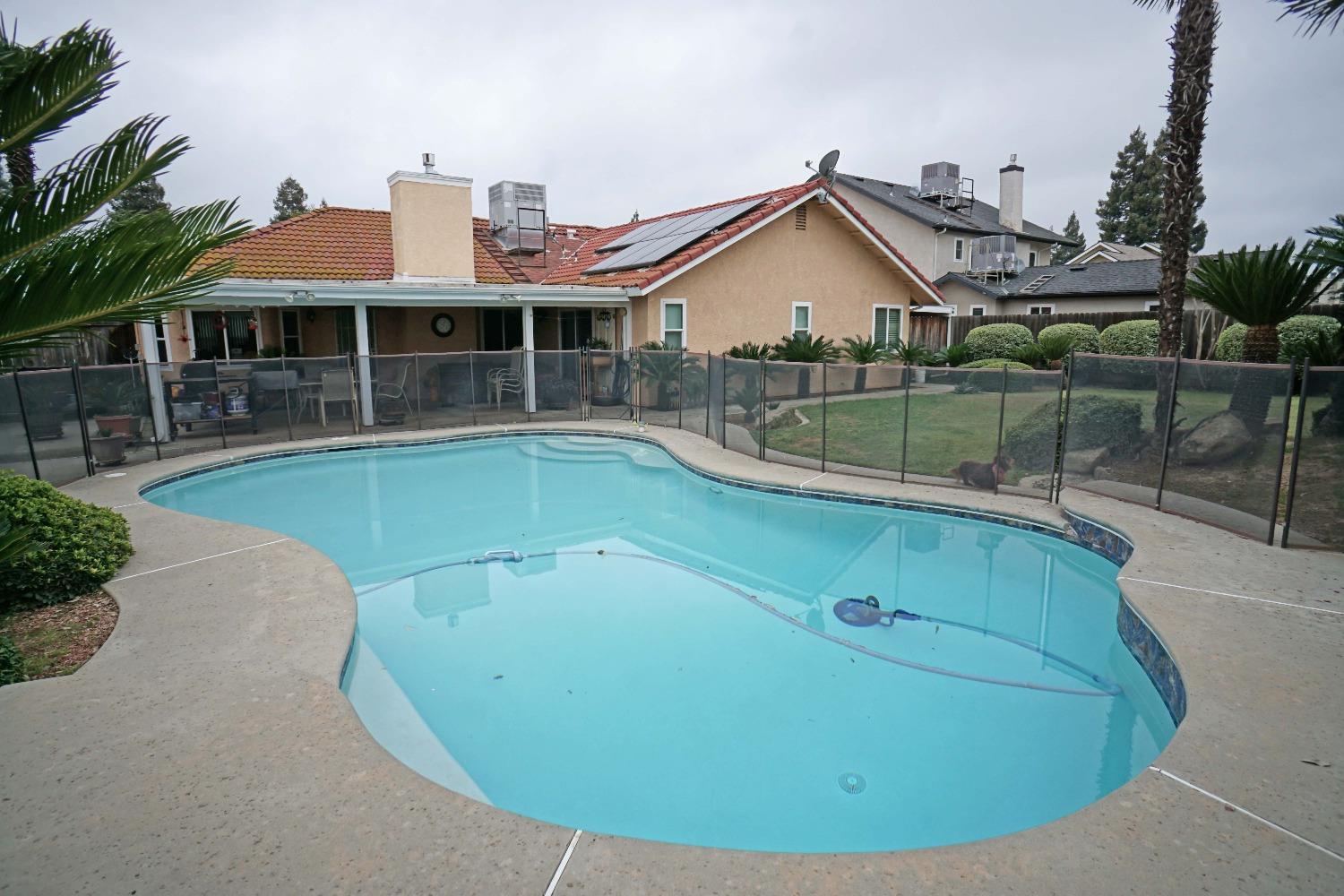 2197 Polson Avenue Clovis, CA 93611 - Photo 33 of 42 a view of a house with a swimming pool