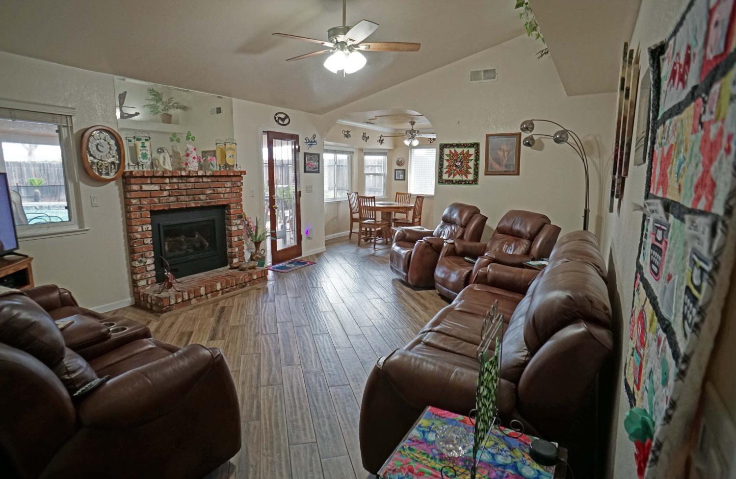 2197 Polson Avenue Clovis, CA 93611 - Photo 5 of 42 a living room with furniture and a fireplace