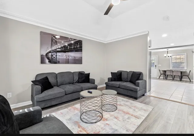 a living room with furniture and a rug