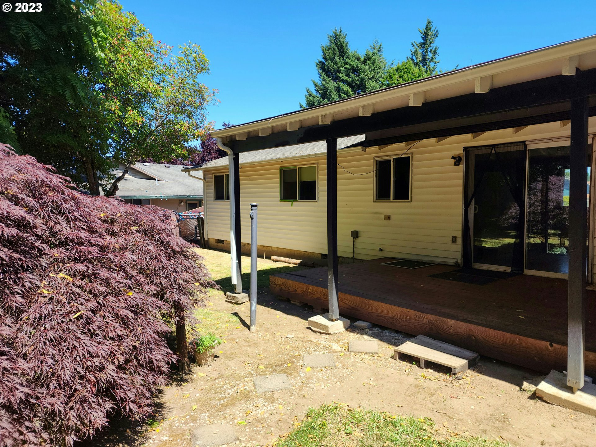 20732 Southeast Main Drive Gresham, OR 97030 - Photo 13 of 27 a front view of a house with a yard