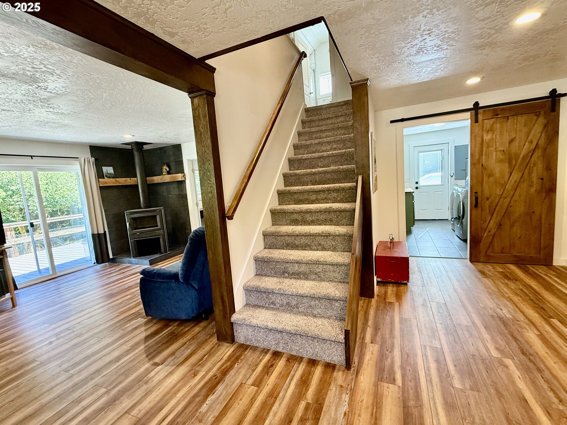 35349 Blitz Lane Blodgett, OR 97326 - Photo 15 of 47 a view of entryway with wooden floor and stairs