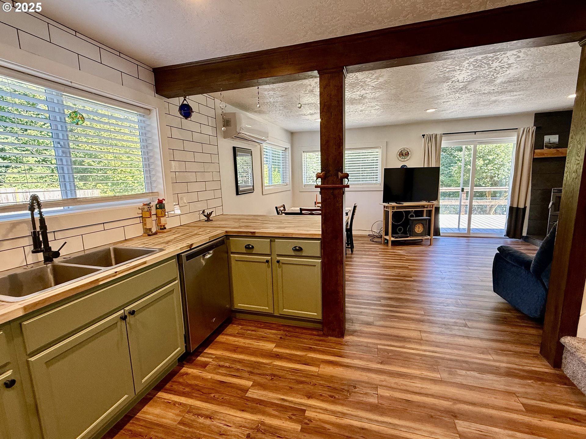 35349 Blitz Lane Blodgett, OR 97326 - Photo 16 of 47 a kitchen with stainless steel appliances granite countertop a sink a stove and a refrigerator