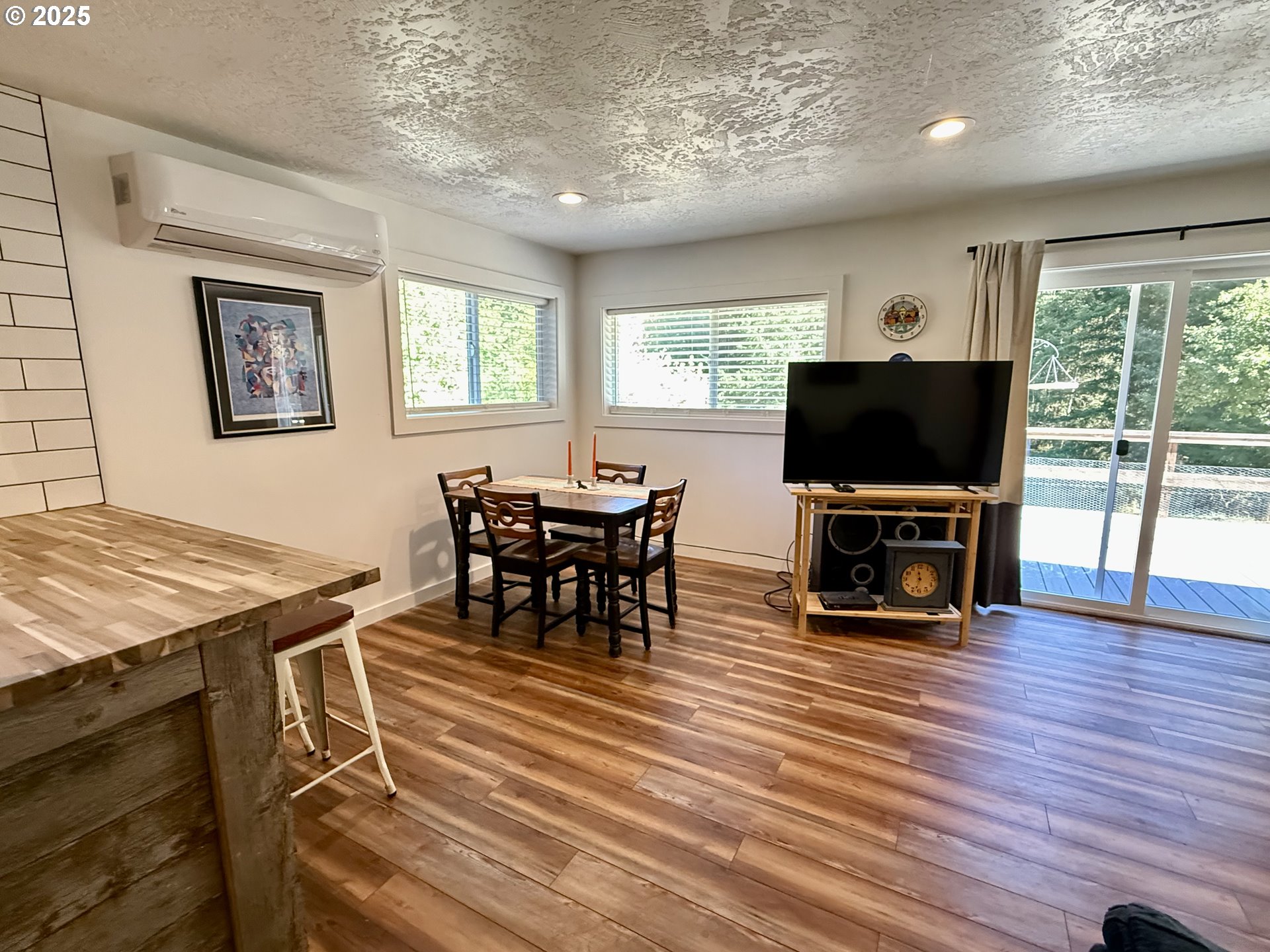 35349 Blitz Lane Blodgett, OR 97326 - Photo 17 of 47 a living room with furniture a fireplace and a flat screen tv