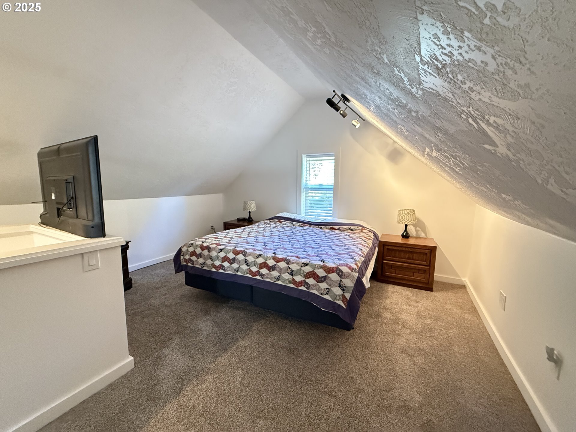 35349 Blitz Lane Blodgett, OR 97326 - Photo 23 of 47 a bedroom with a bed and a table in it