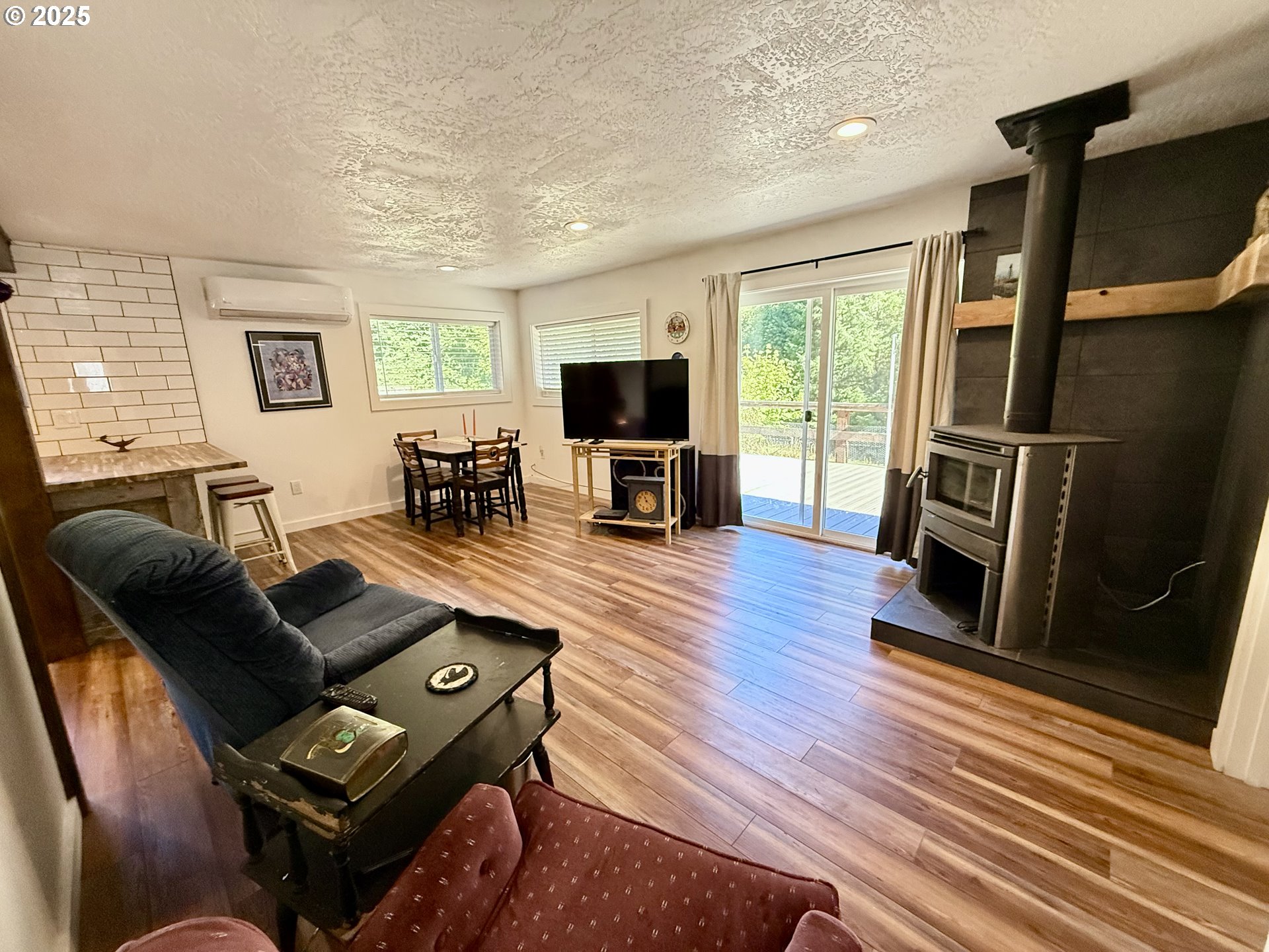 35349 Blitz Lane Blodgett, OR 97326 - Photo 6 of 47 a living room with furniture and a flat screen tv