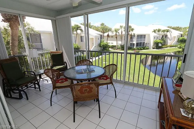 a view of a city from a dining room with furniture window and outside view