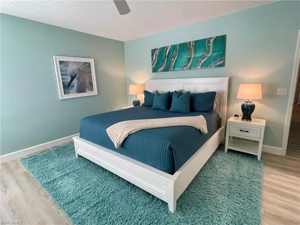 a bedroom with a bed and a couch