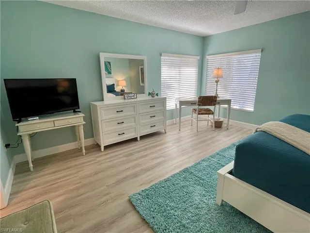 a room with furniture and a flat screen tv