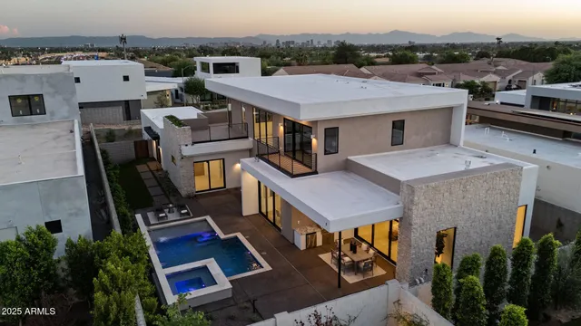 an aerial view of a house with balcony and outdoor space