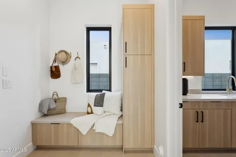 a dining room with furniture and a large window