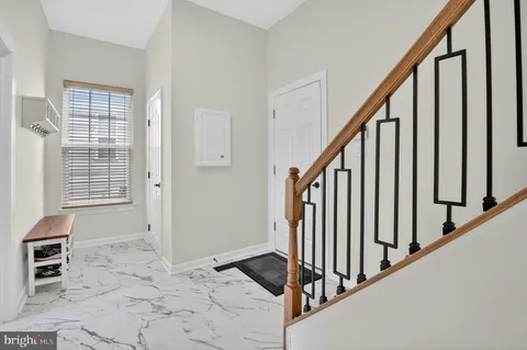 a spacious bedroom with a bed and a flat screen tv
