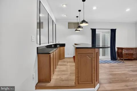 a bathroom with a sink a toilet and shower a mirror
