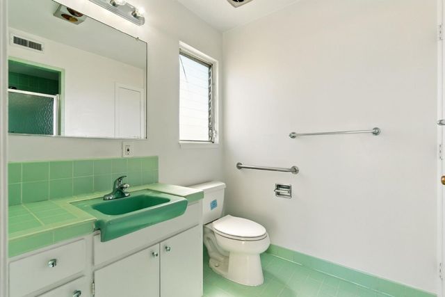 a bathroom with a sink and a toilet