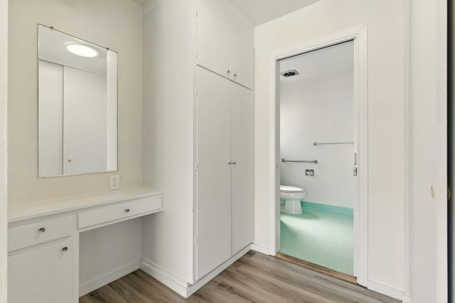 a bathroom view of a toilet and a sink