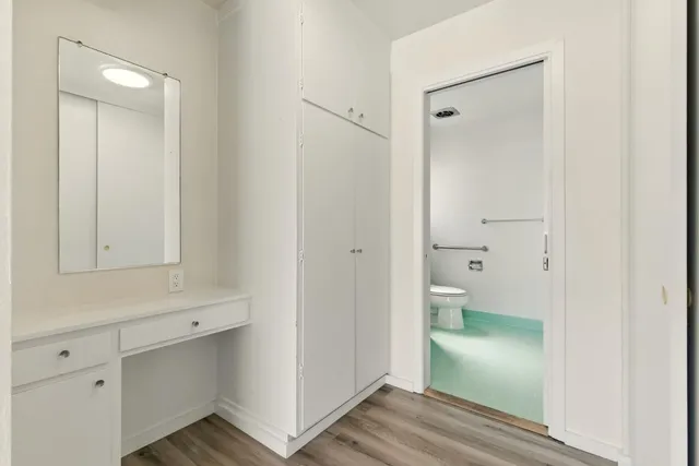 a bathroom view of a toilet and a sink