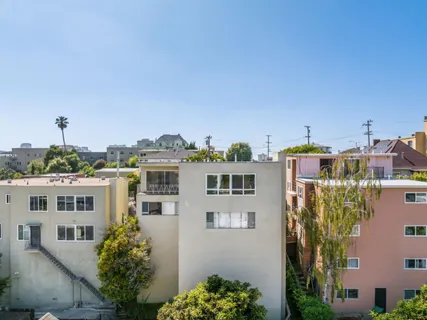 a front view of a house with a yard garage and outdoor seating