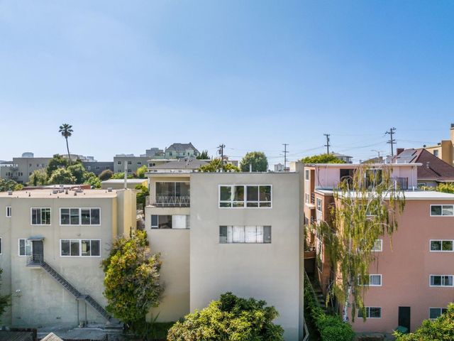 a front view of a house with a yard garage and outdoor seating