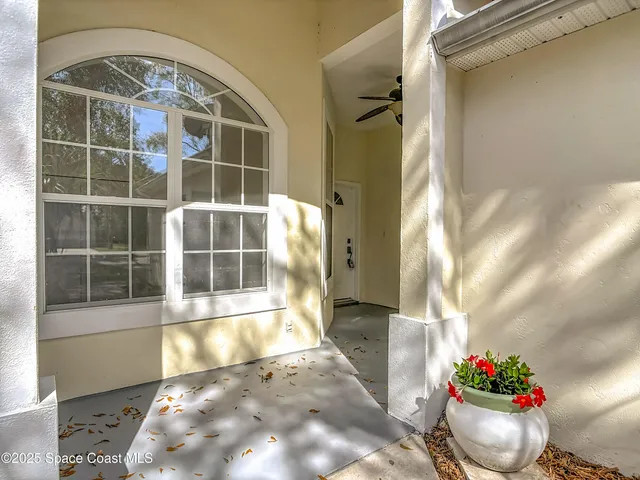 a kitchen with granite countertop white cabinets white stainless steel appliances and a sink