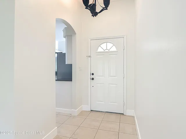 a kitchen with cabinets a refrigerator and a sink