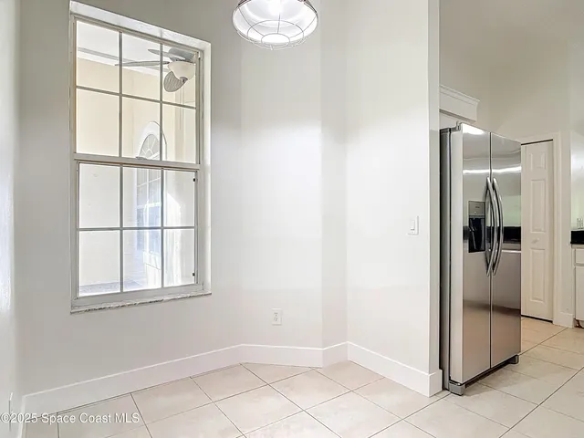 a kitchen with stainless steel appliances a sink and a refrigerator