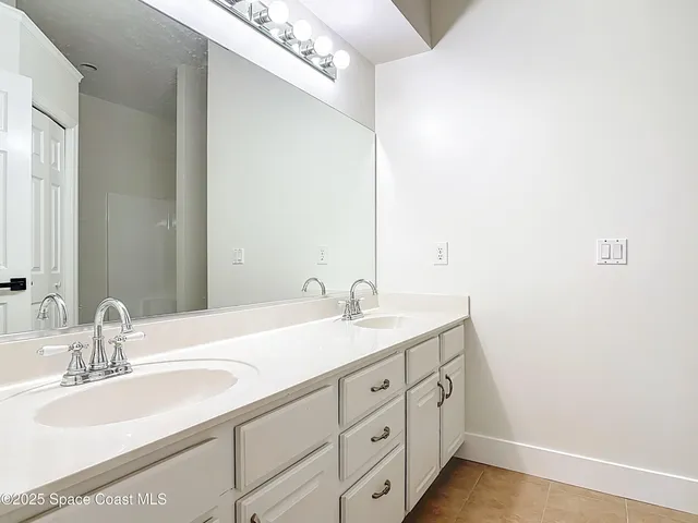 a view of a utility room with furniture and a window