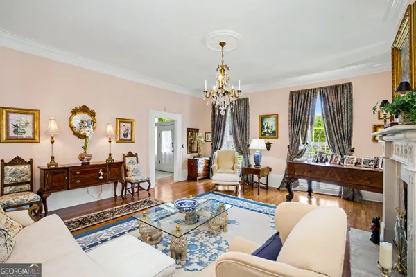 a kitchen with stainless steel appliances granite countertop a stove a sink dishwasher and cabinets with wooden floor