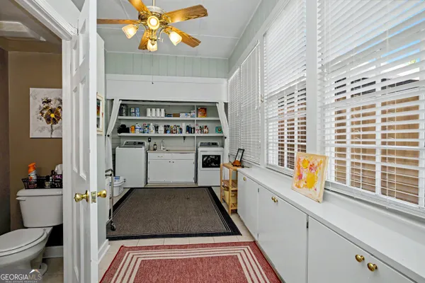 a bedroom with a bed window and fireplace