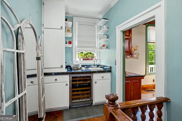 a bedroom with a bed furniture and a book shelf