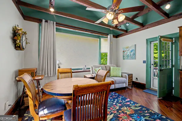 a balcony with table and chairs