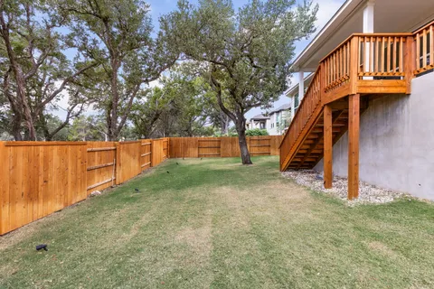 a backyard of a house with lots of green space