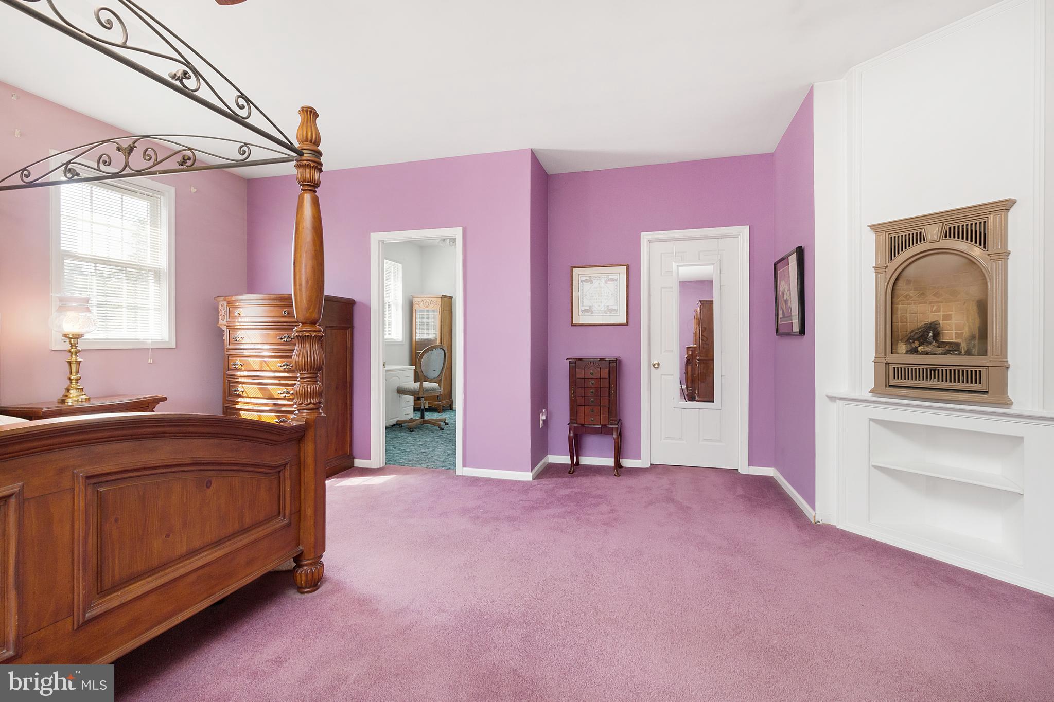 1921 Hatfield Road Huntingtown, MD 20639 - Photo 22 of 36 Master Bedroom w/ Fireplace Insert