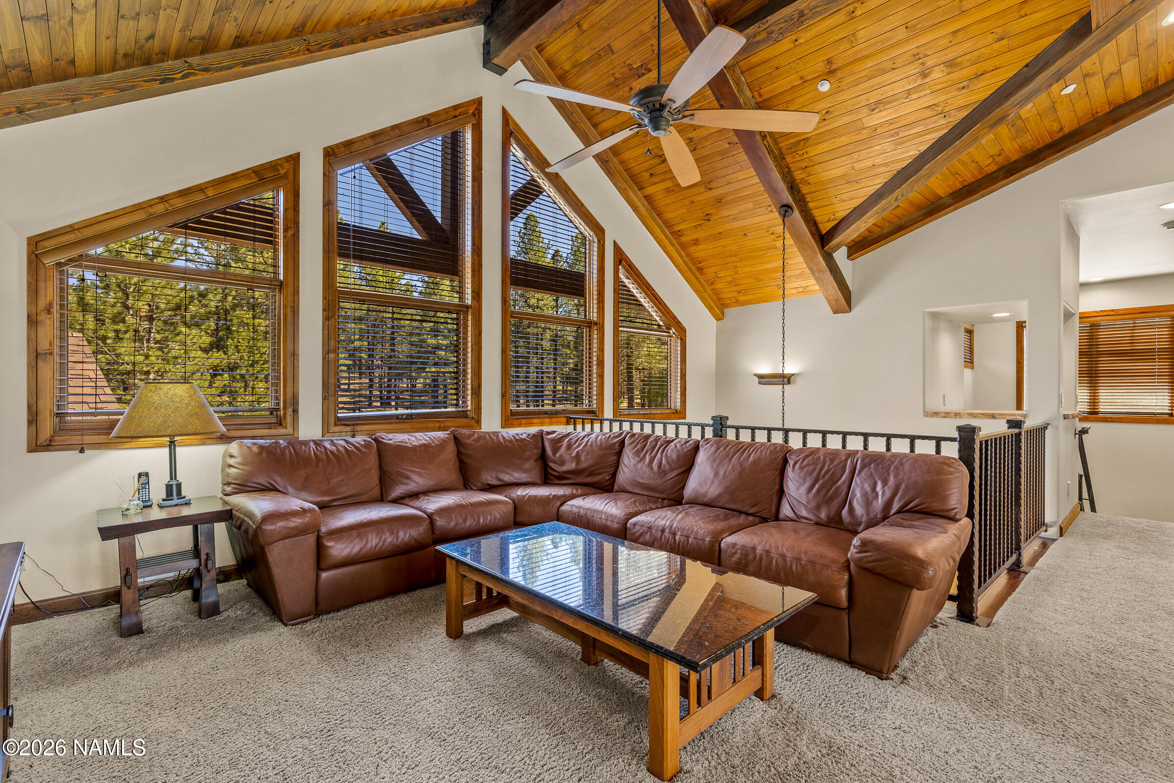 2214 East Del Rae Drive Flagstaff, AZ 86005 - Photo 24 of 45 a living room with furniture and a large window