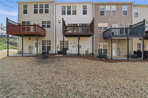 a view of a brick building with many windows