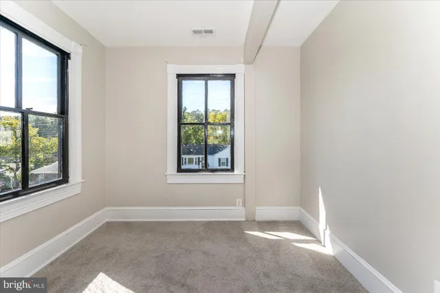 an empty room with windows