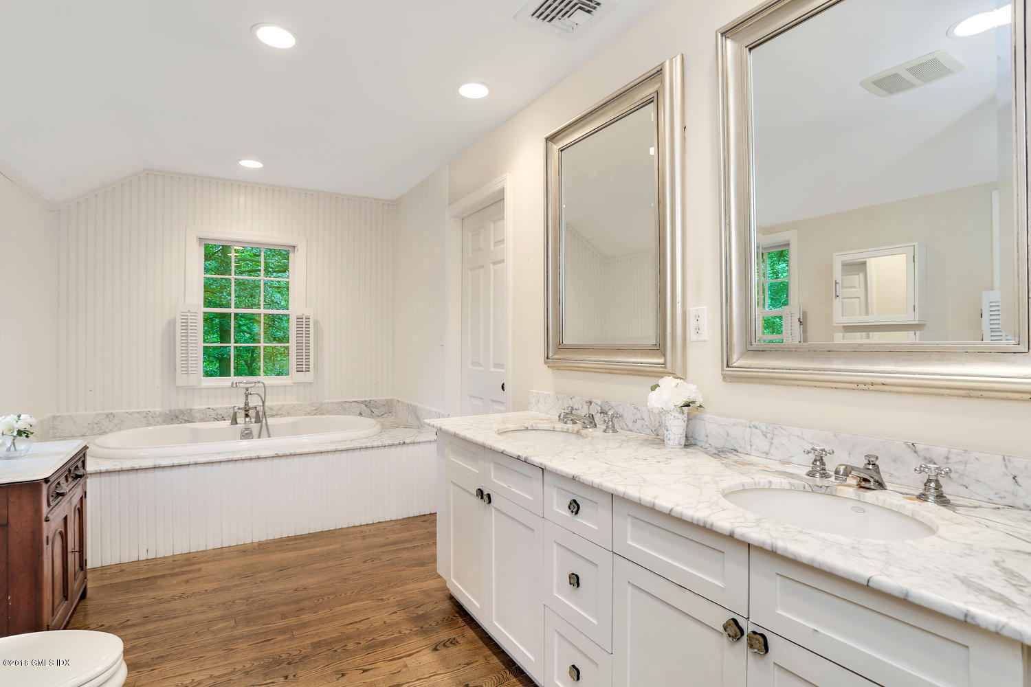 125 Hendrie Avenue Riverside, CT 06878 - Photo 14 of 24 a bathroom with a granite countertop sink mirror and a bath tub