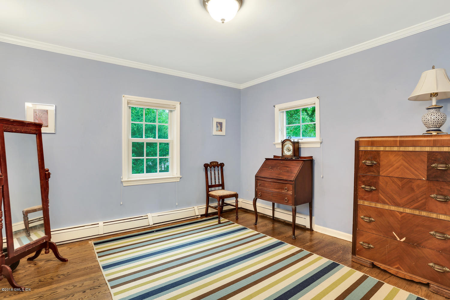 125 Hendrie Avenue Riverside, CT 06878 - Photo 15 of 24 a bedroom with furniture and a window