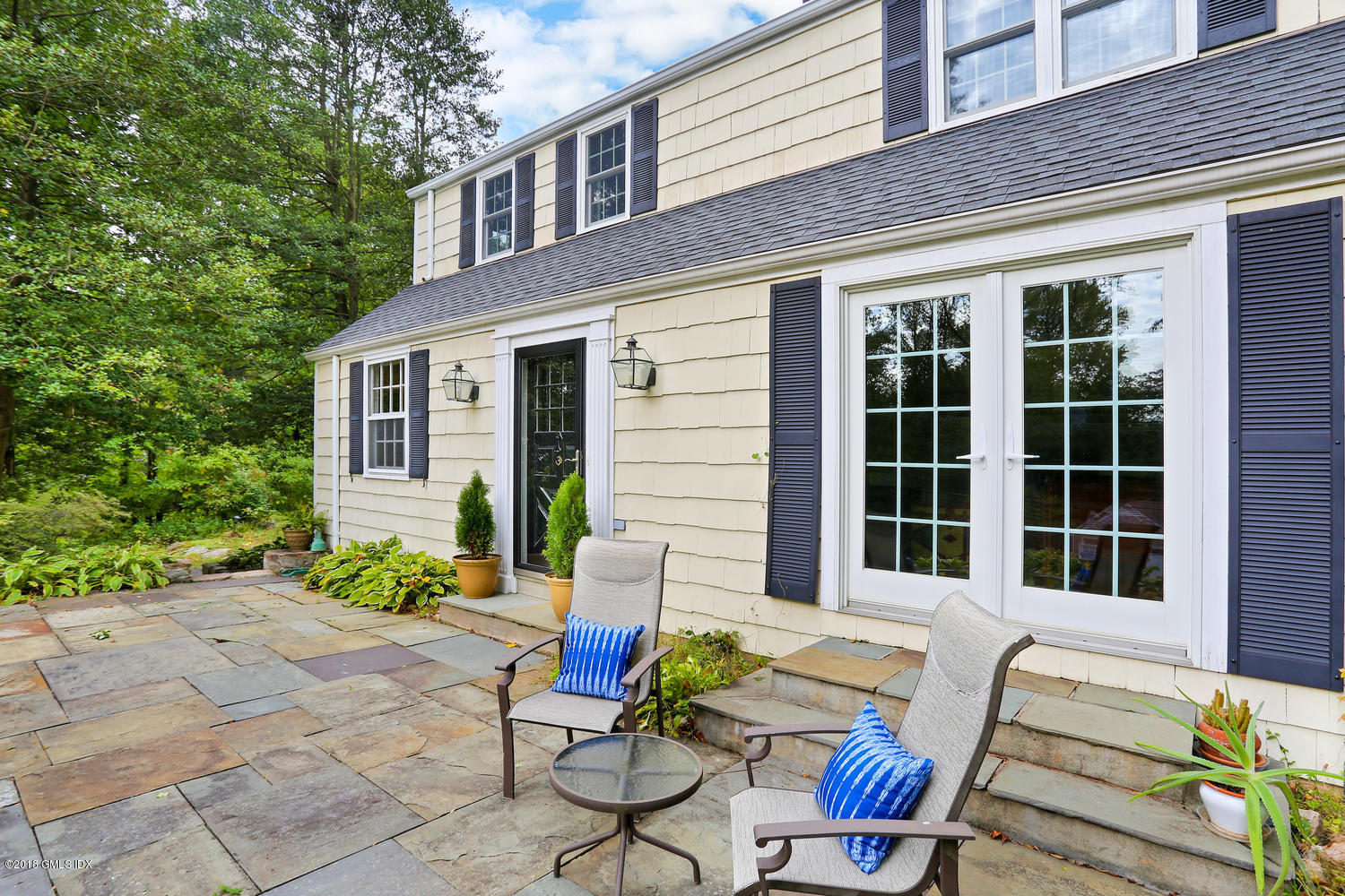 125 Hendrie Avenue Riverside, CT 06878 - Photo 18 of 24 a view of a house with backyard and sitting area
