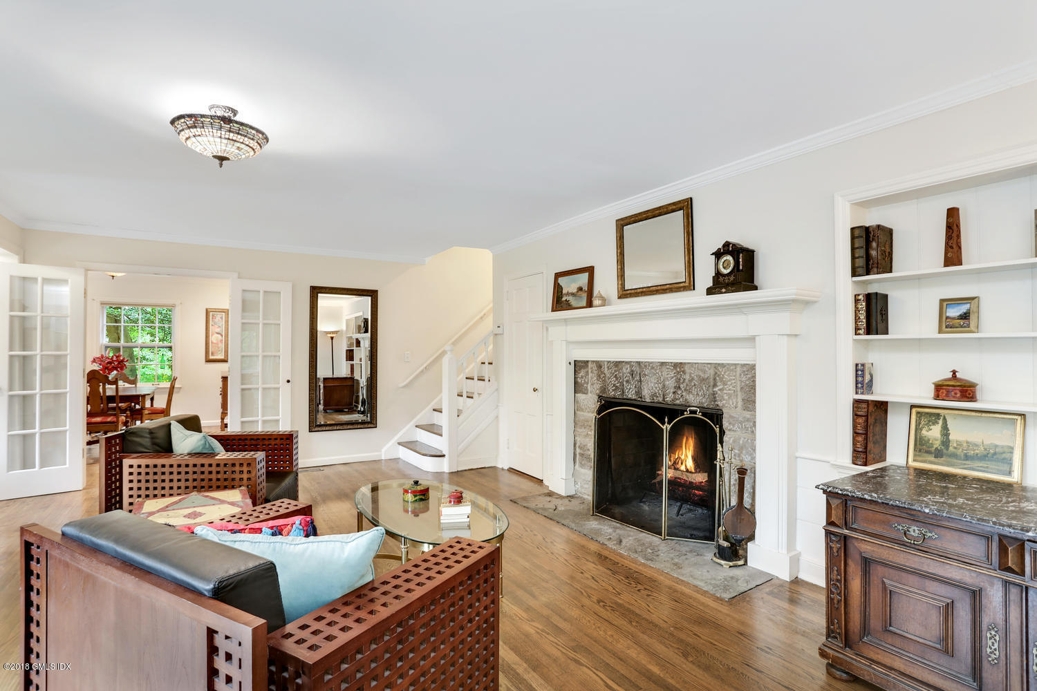 125 Hendrie Avenue Riverside, CT 06878 - Photo 4 of 24 a living room with furniture and a fireplace