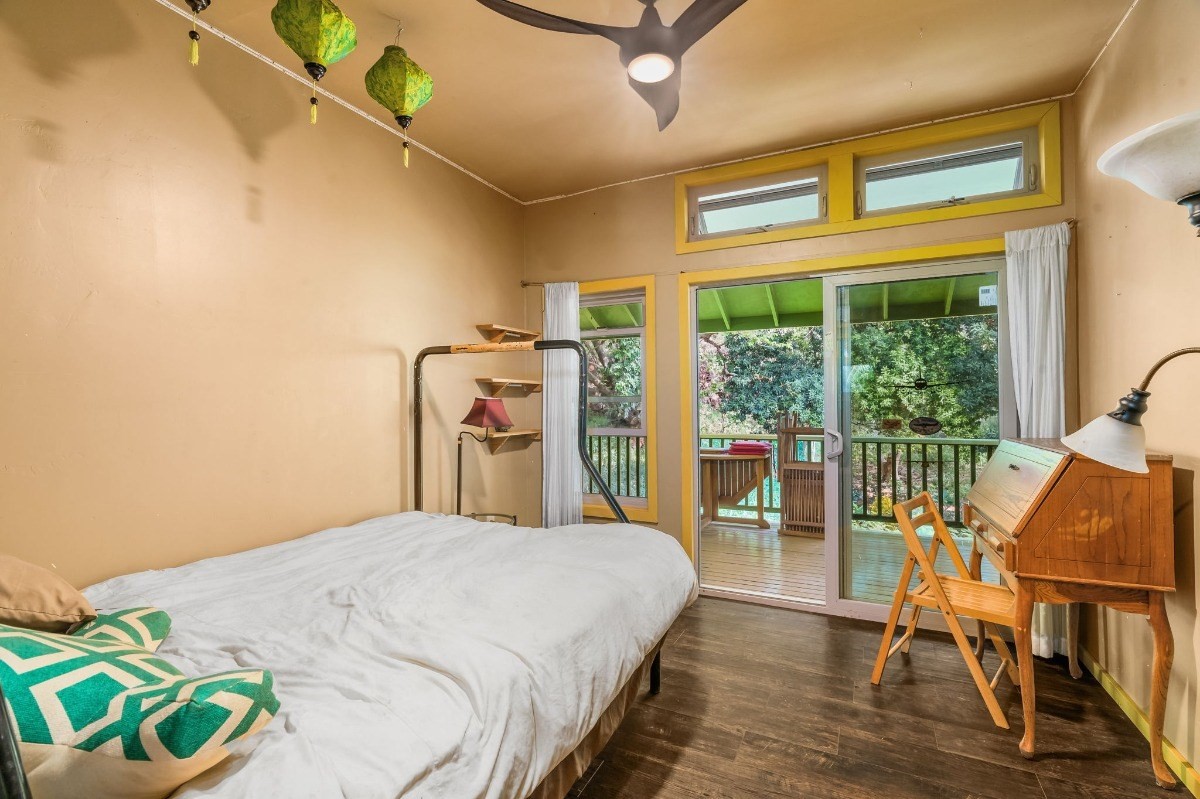 5011 Awawa Road Kalaheo, HI 96741 - Photo 16 of 30 a large bed sitting in a bedroom next to a window