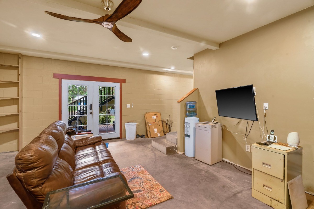 5011 Awawa Road Kalaheo, HI 96741 - Photo 24 of 30 a living room with furniture and a flat screen tv