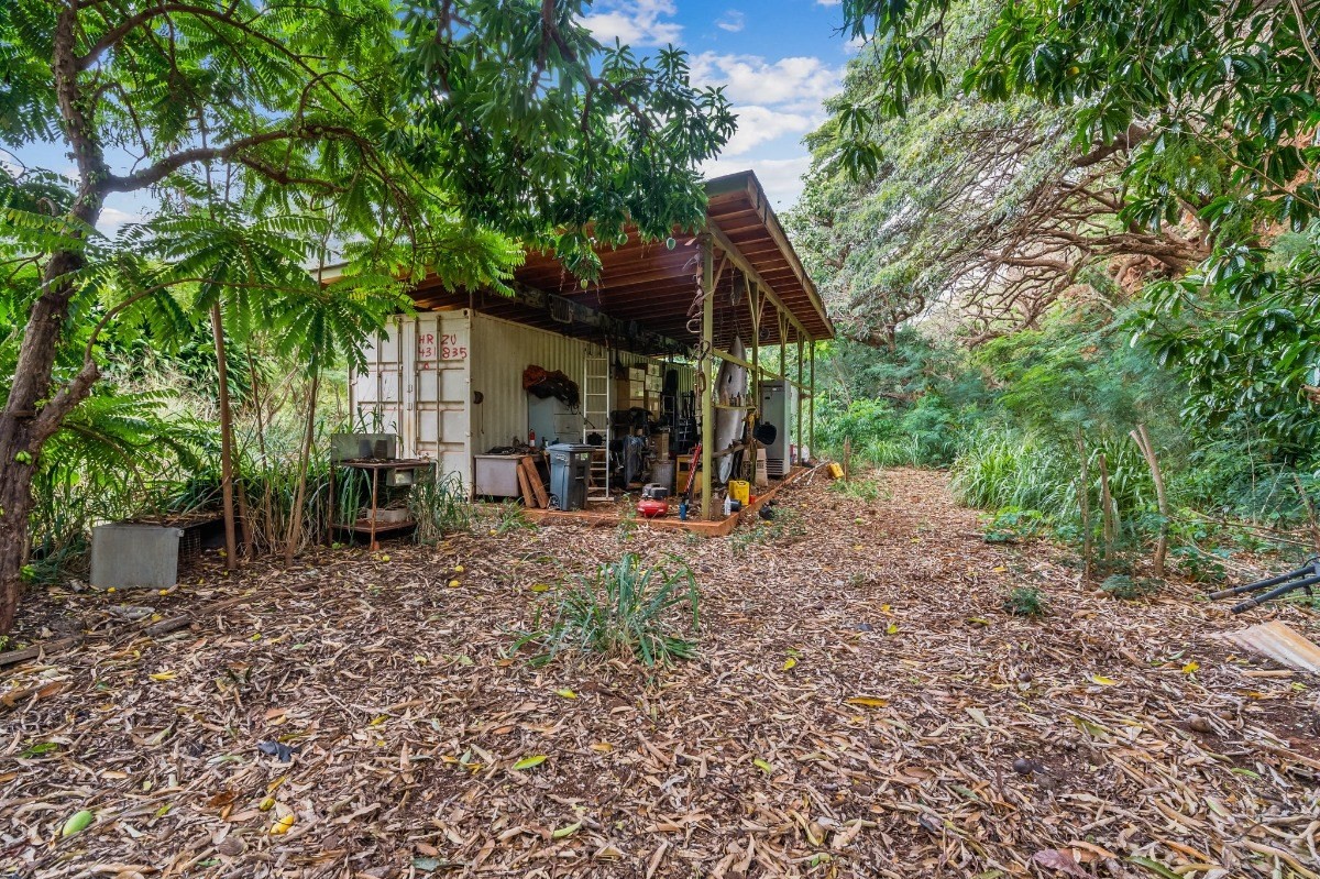 5011 Awawa Road Kalaheo, HI 96741 - Photo 28 of 30 a view of a wooden house with a big yard and large trees