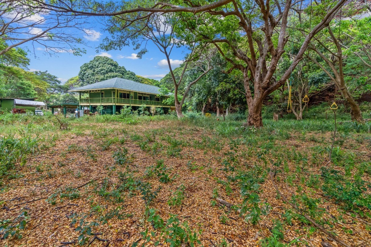 5011 Awawa Road Kalaheo, HI 96741 - Photo 29 of 30 a front view of a house with a yard