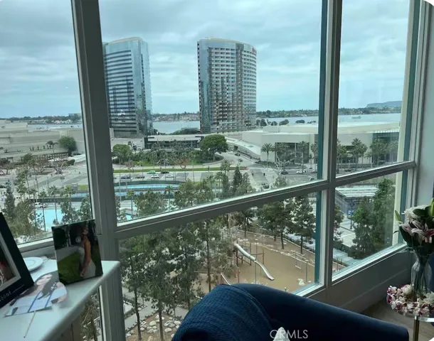 a view of a balcony with couches and wooden floor