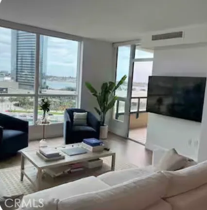 a living room with furniture fireplace and a flat screen tv