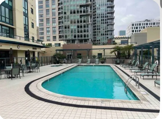 a view of swimming pool with outdoor seating
